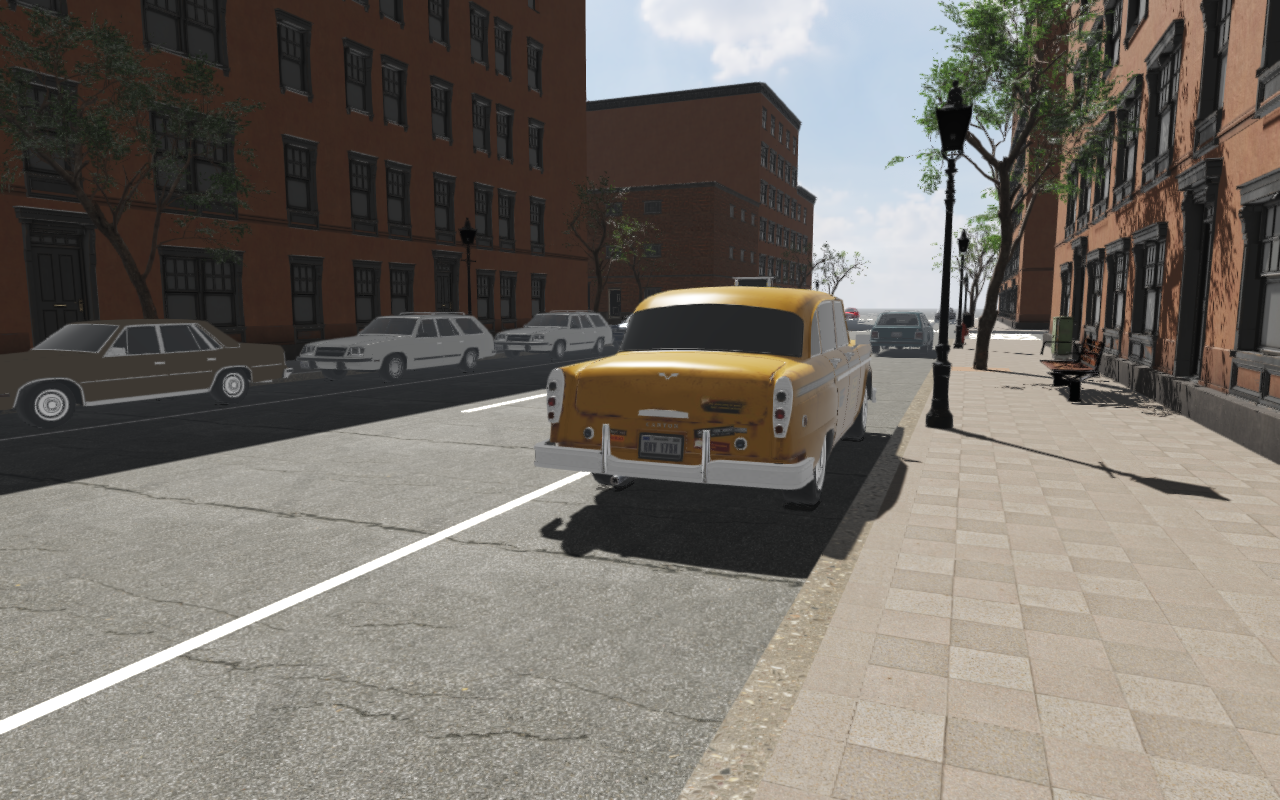 Parked cars, lamps, trees and benches along a sidewalk