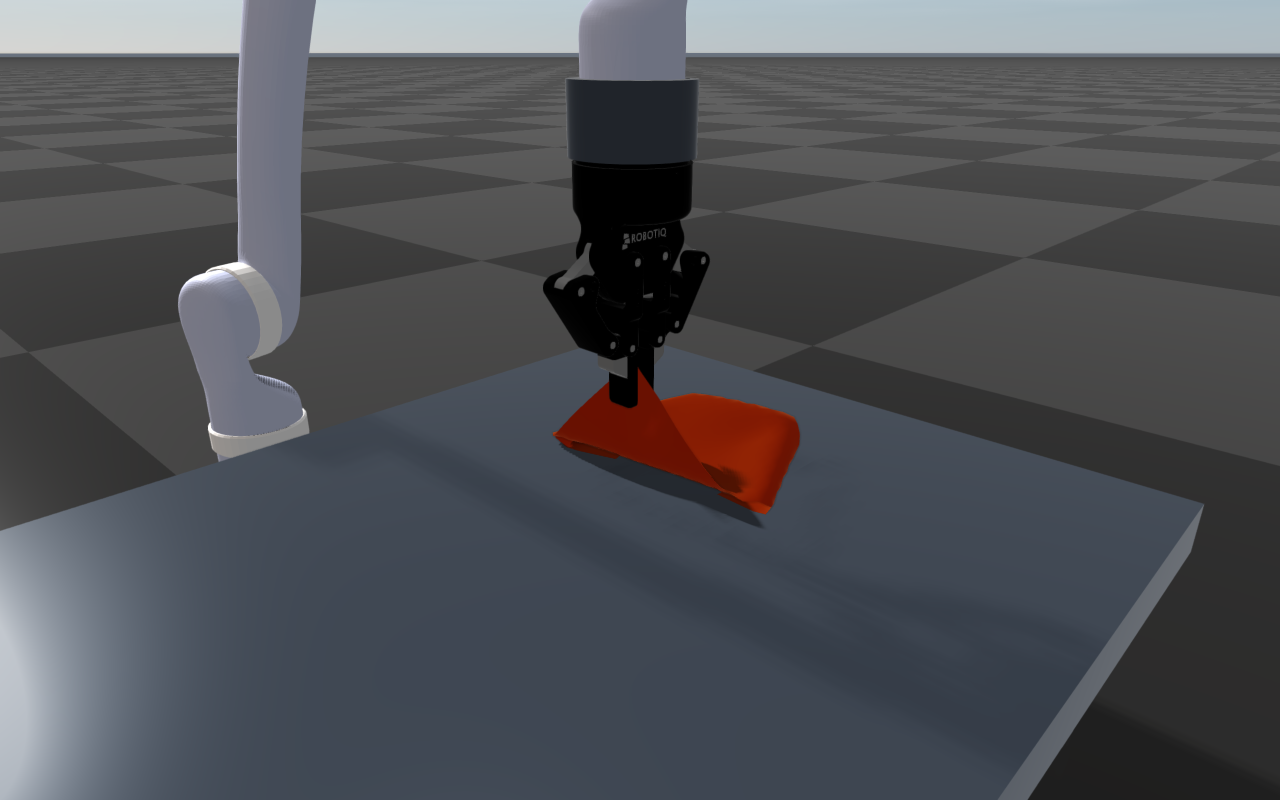 Kinova arm with a Robotiq 2F-85 folding a red cloth on a table
